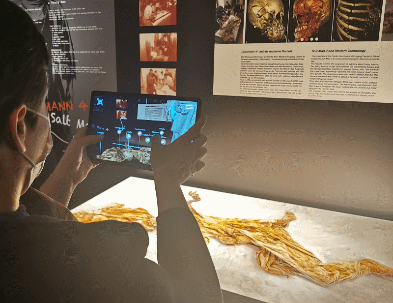 Visitor uses tablet in museum